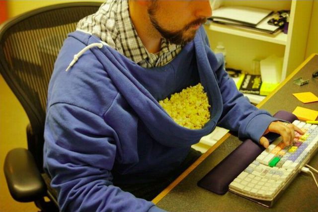 genius-eating-popcorn-desk-hood-13598313019.jpg