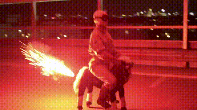 random-man-riding-toy-horse-firework-13587137278.gif