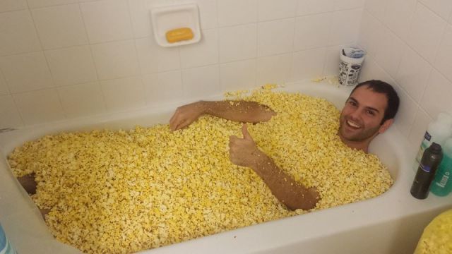 guy-in-bath-full-of-popcorn-corn-1381771