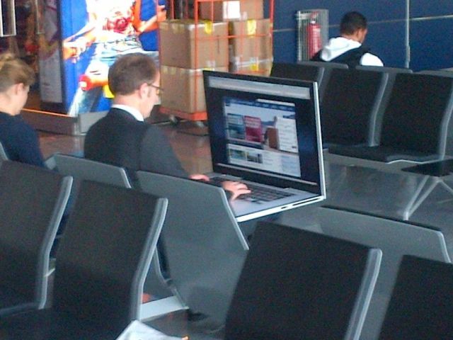 airport-guy-suit-massive-laptop-13497307201.jpg