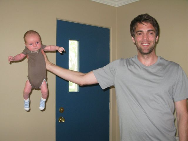 how-to-hold-a-baby-guy-holding-baby-one-hand-13694168408.jpg
