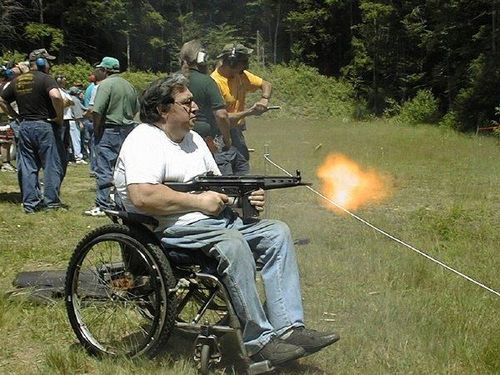 IRTI - funny picture #2729 - tags: wheelchair firing gun machine gun spray